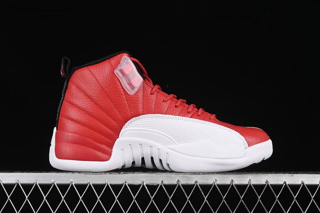 Side profile of the red and white high-top sneaker