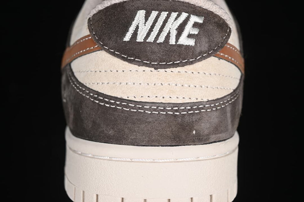 Rear view showing the heel panel, stitching, and off-white sole.