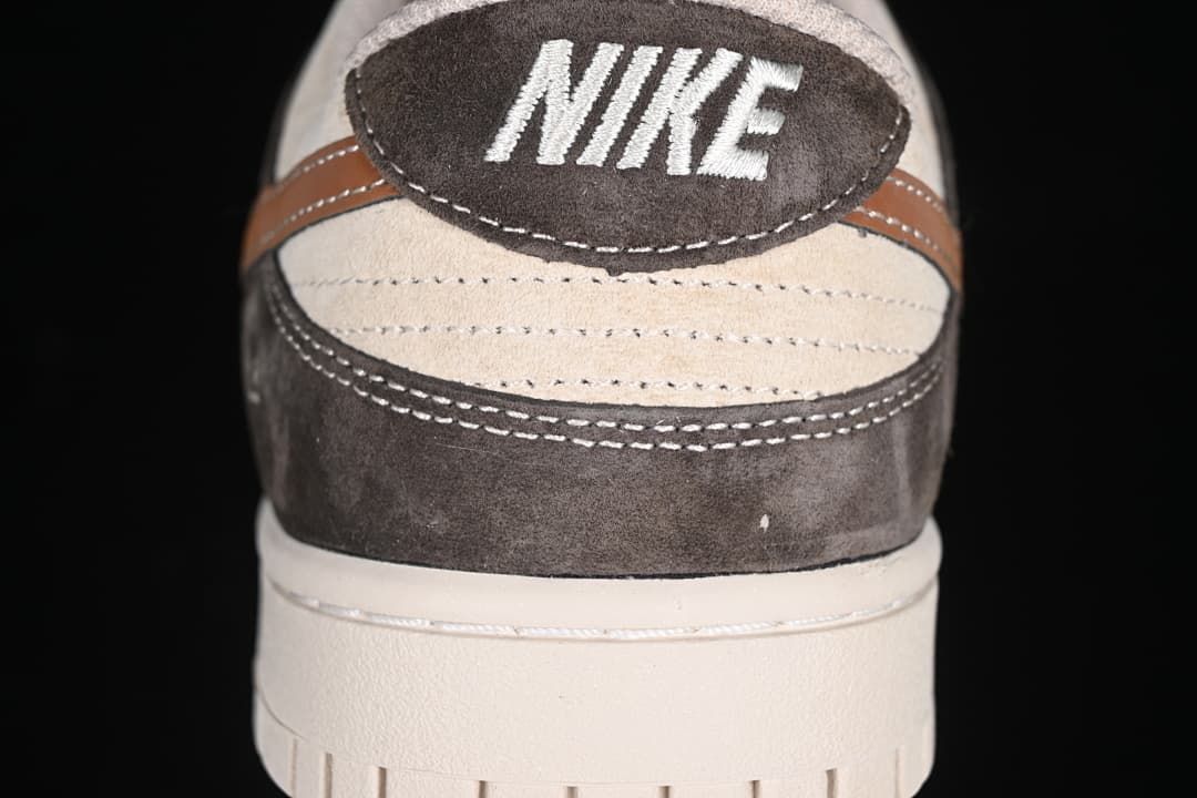 Rear view showing the heel panel, stitching, and off-white sole.