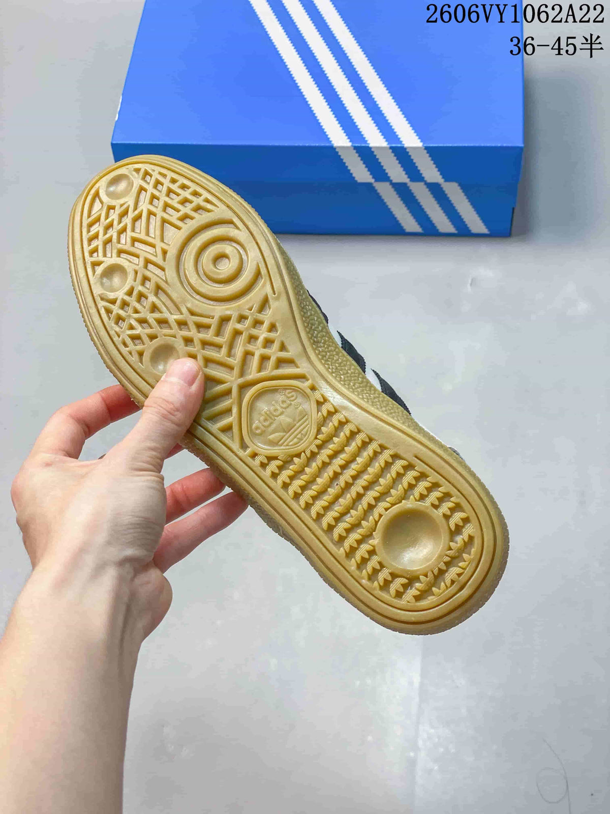 Close-up of the textured gum-colored outsole on an Adidas Handball Spezial sneaker
