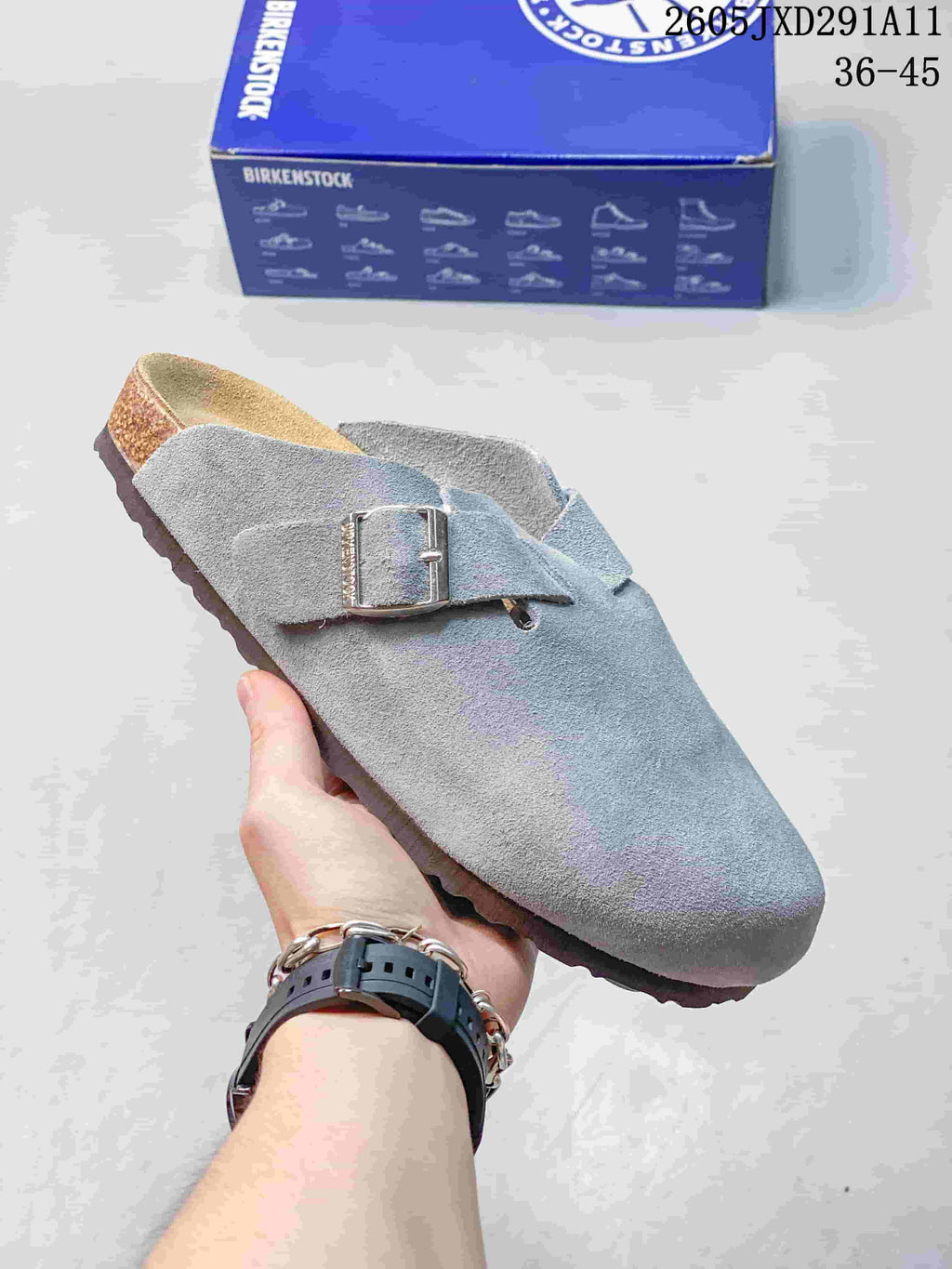 Gray suede-like Zurich-style clog sandal with an adjustable buckle strap