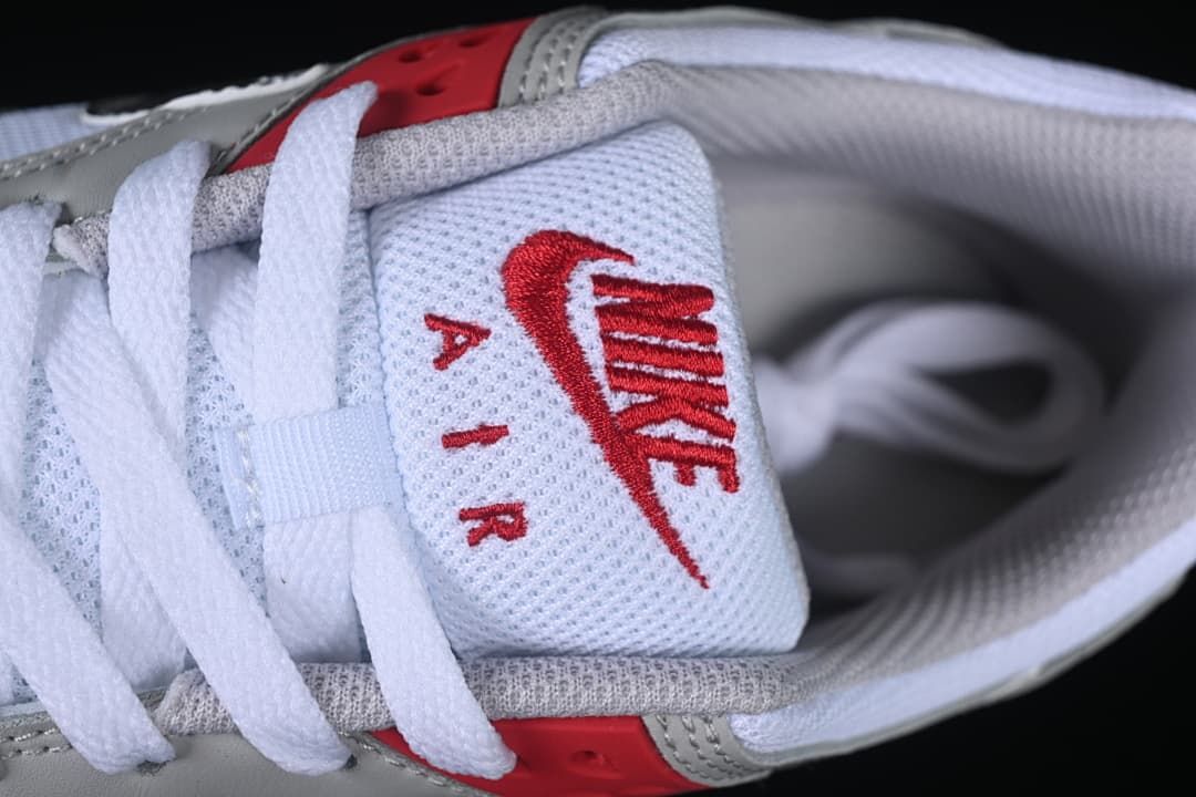 Close-up of the white tongue with red Nike Air branding and white laces.