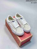 Pair of white and light gray Vans SK8-Low sneakers shown with a Vans shoe box.