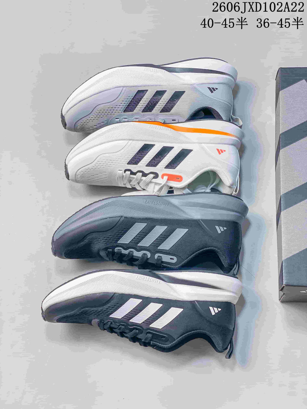 Several views of the white and dark gray Adidas sneaker colorways.
