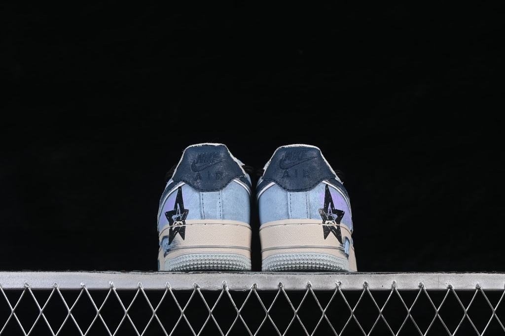 Rear view of both sneakers with star graphics on the heels