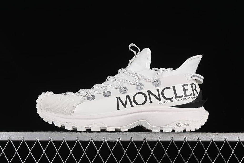 White Moncler Trailgrip Lite2 sneaker shown in side profile