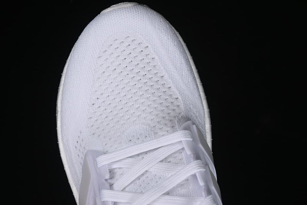 Top-down close-up of the knit-look toe and lacing.