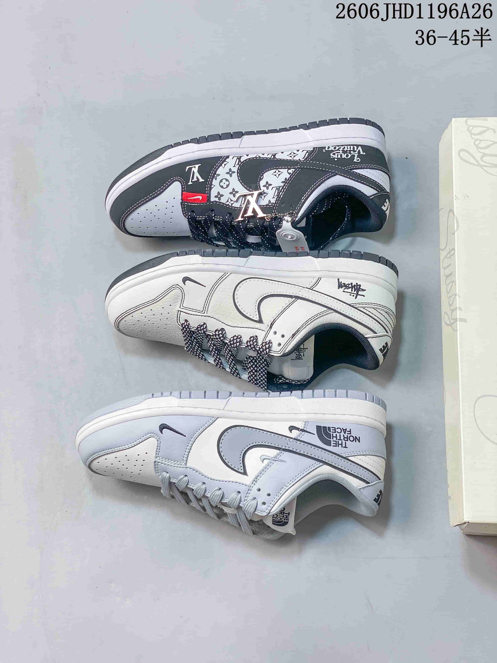 Three low-top sneaker designs shown together: dark gray patterned, white, and light gray.