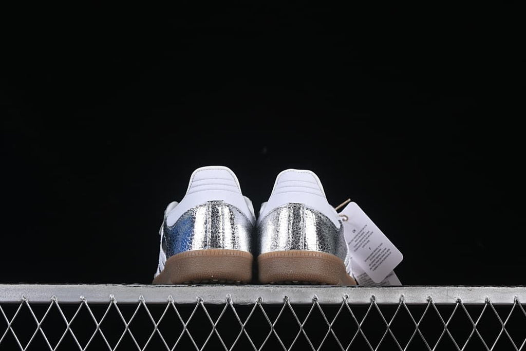 Rear view of the pair showing silver heel panels and gum-colored soles
