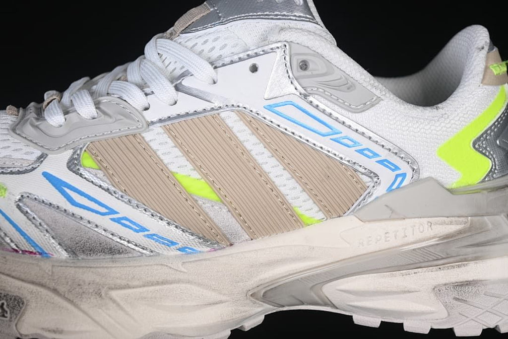 Close-up of the layered side panels, three stripes, and sculpted midsole.