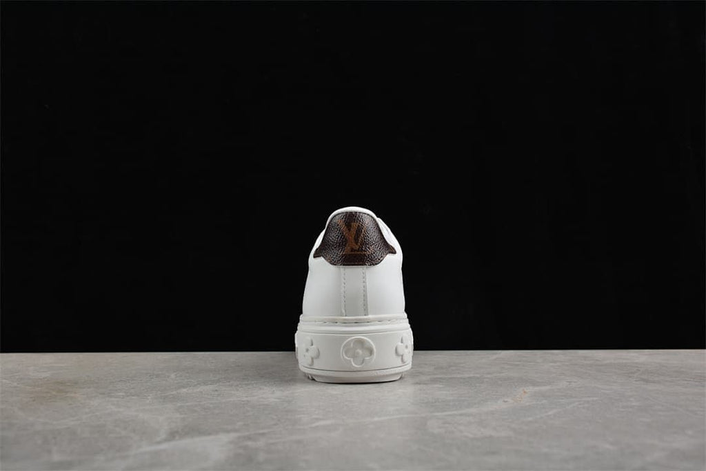 Rear view showing the brown heel panel and raised patterned sole