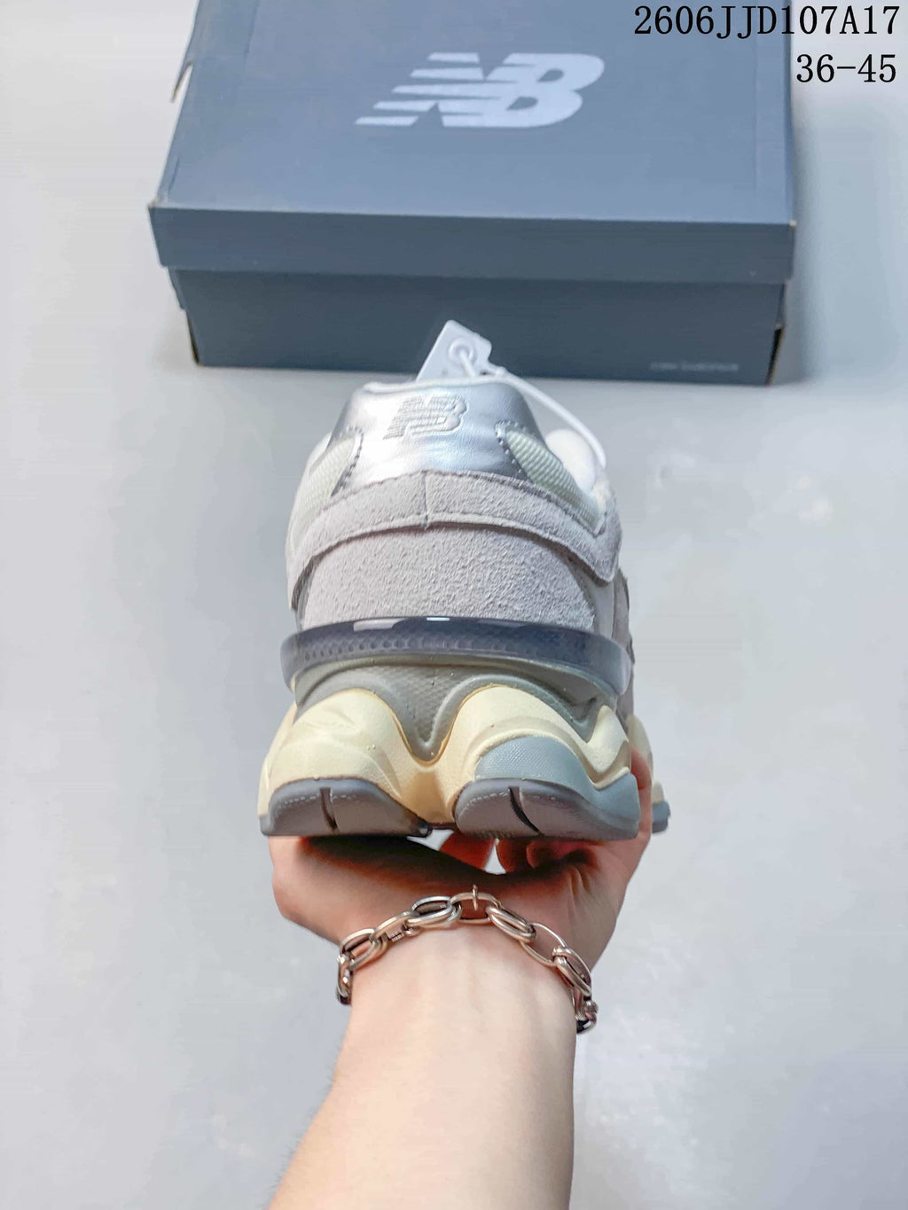 Rear view of a grey New Balance 9060 sneaker