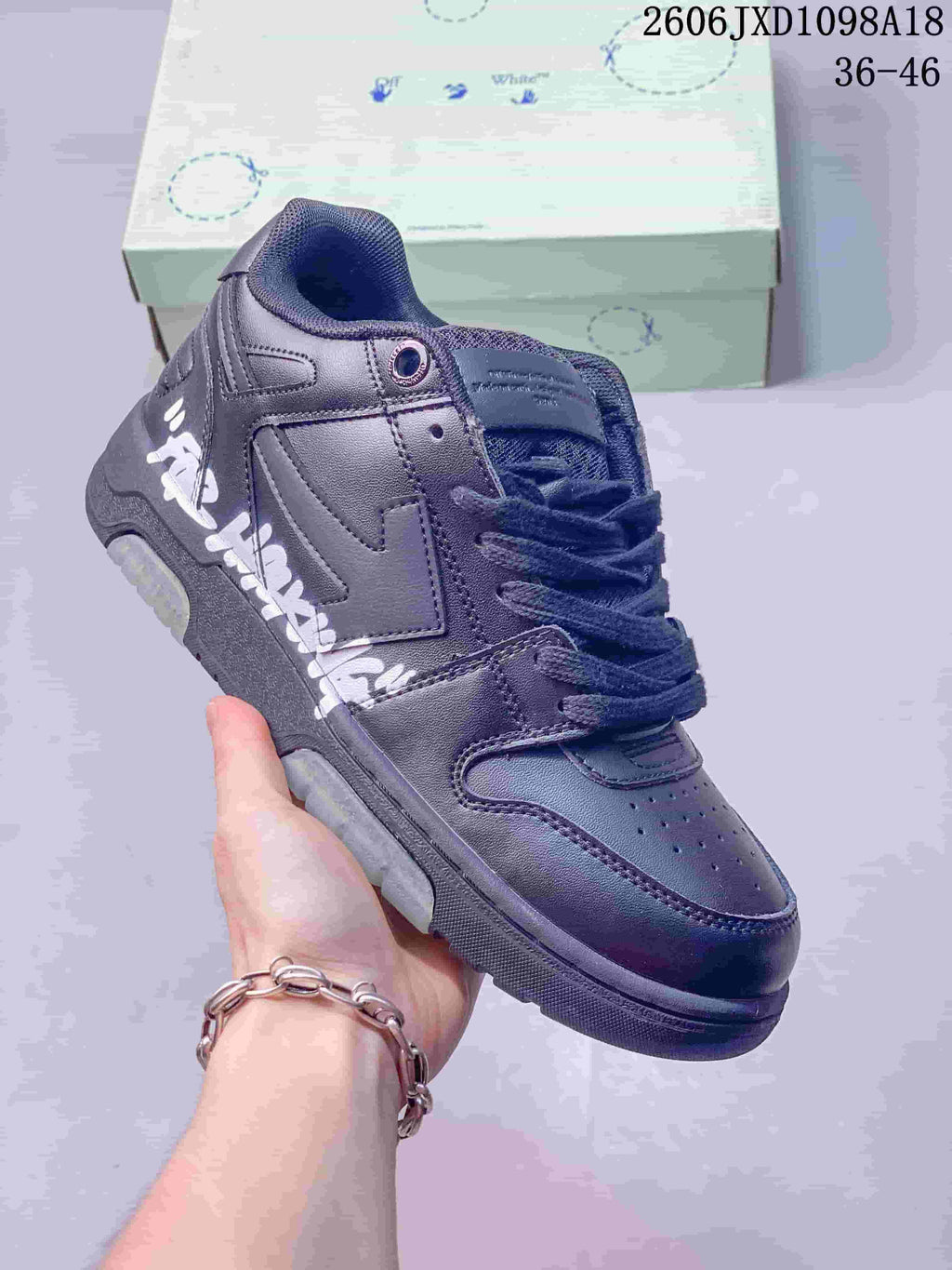 Angled close-up of the sneaker showing white side lettering and a large side logo motif