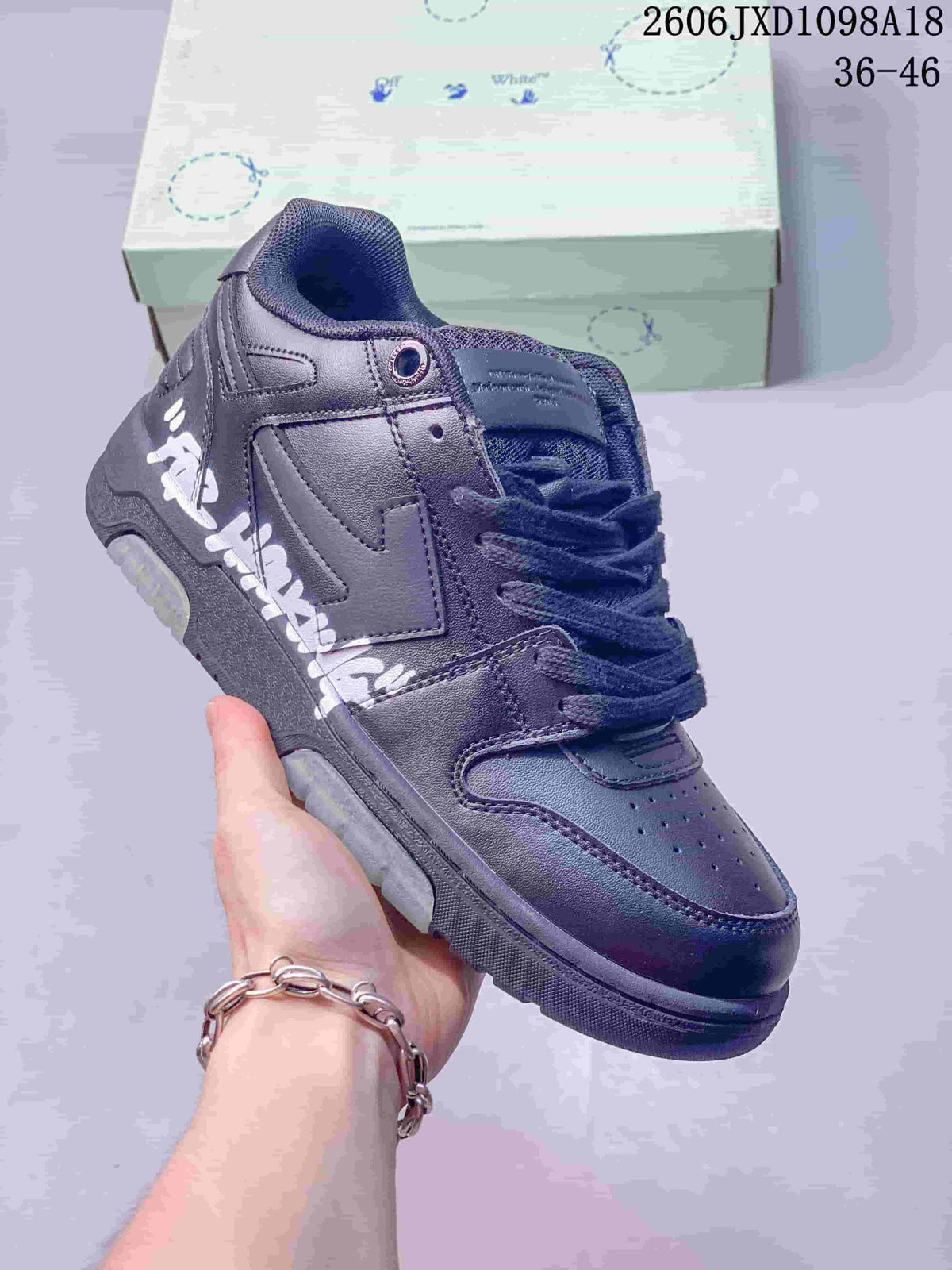 Angled close-up of the sneaker showing white side lettering and a large side logo motif