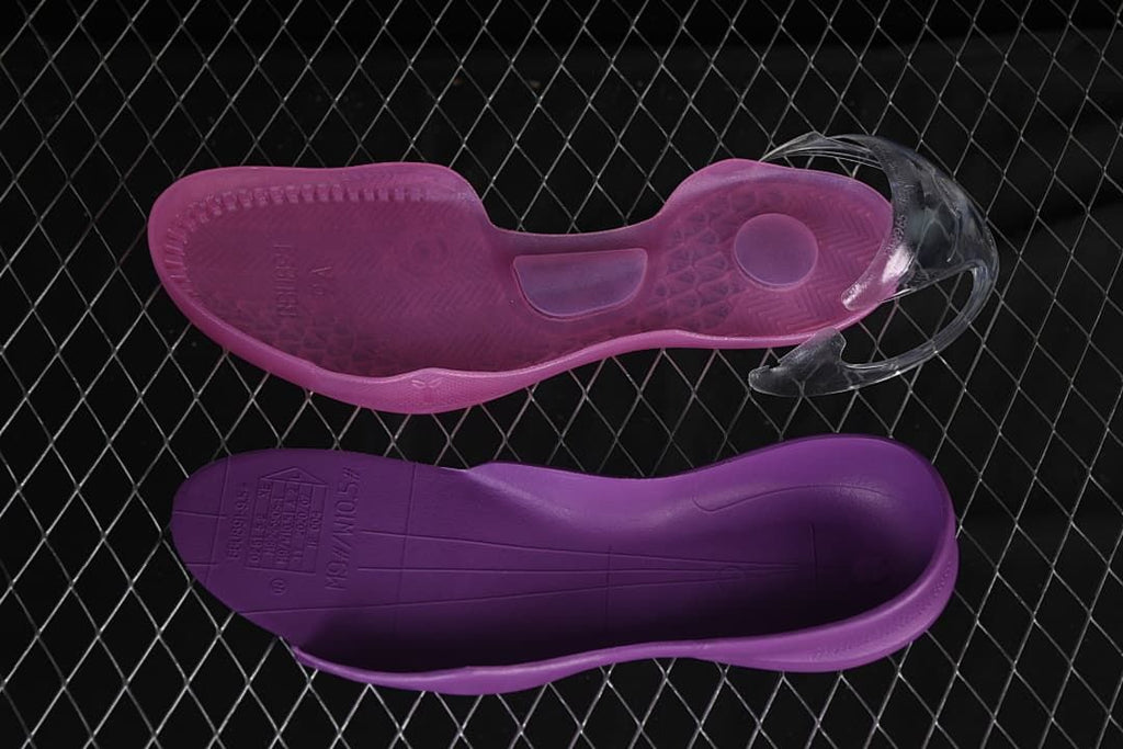 Purple and dark violet shoe components shown from below
