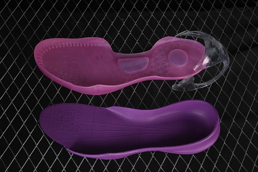 Purple and dark violet shoe components shown from below