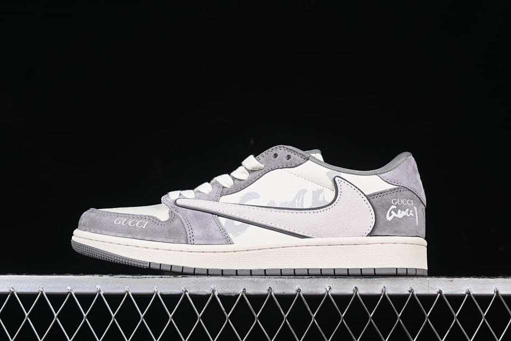 Side view of a white and gray low-top sneaker with graphic side details