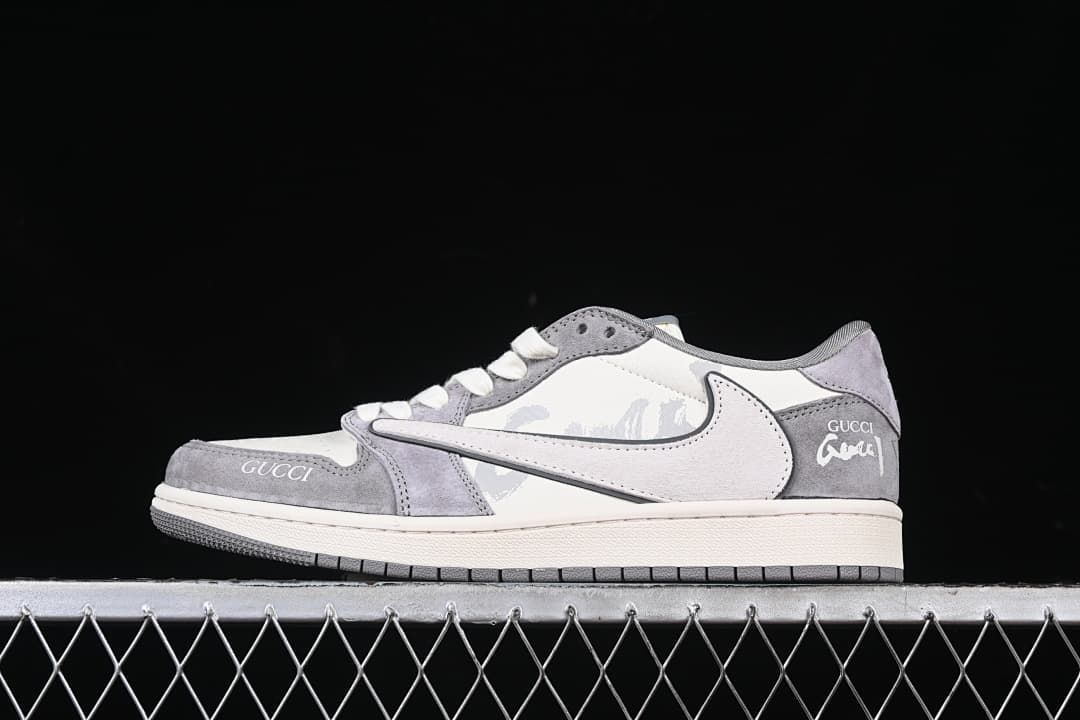 Side view of a white and gray low-top sneaker with graphic side details