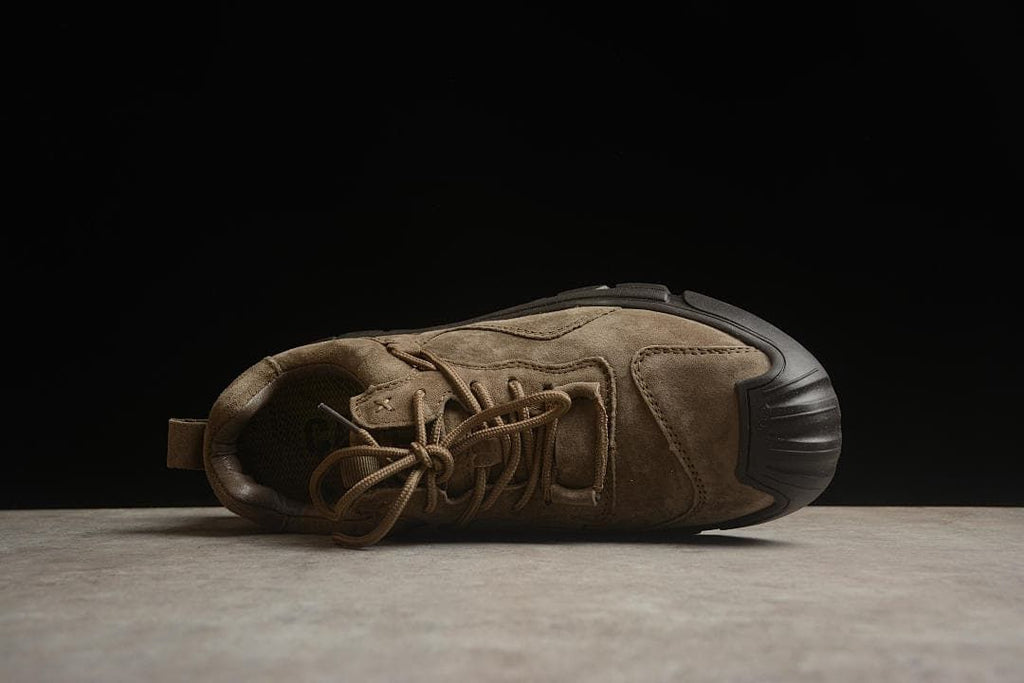 Top view of the shoe showing the laces, collar, and layered upper.