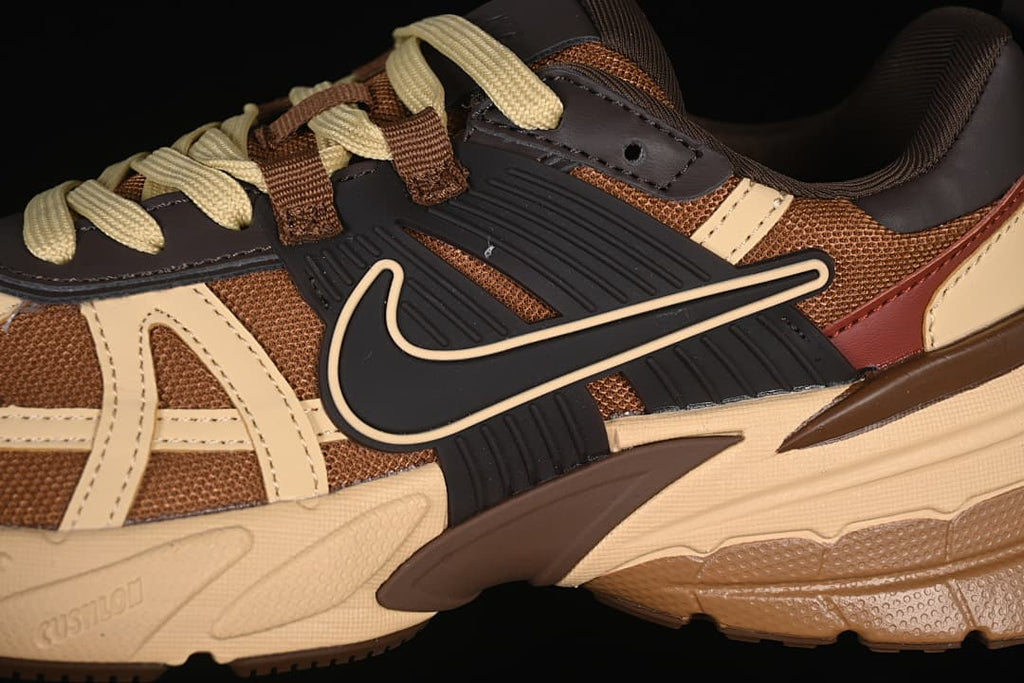 Close-up of the side Swoosh, layered panels, and sole