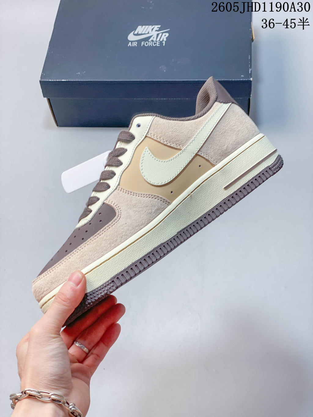 Side view of a beige and brown Nike Air Force 1 '07 LV8 sneaker