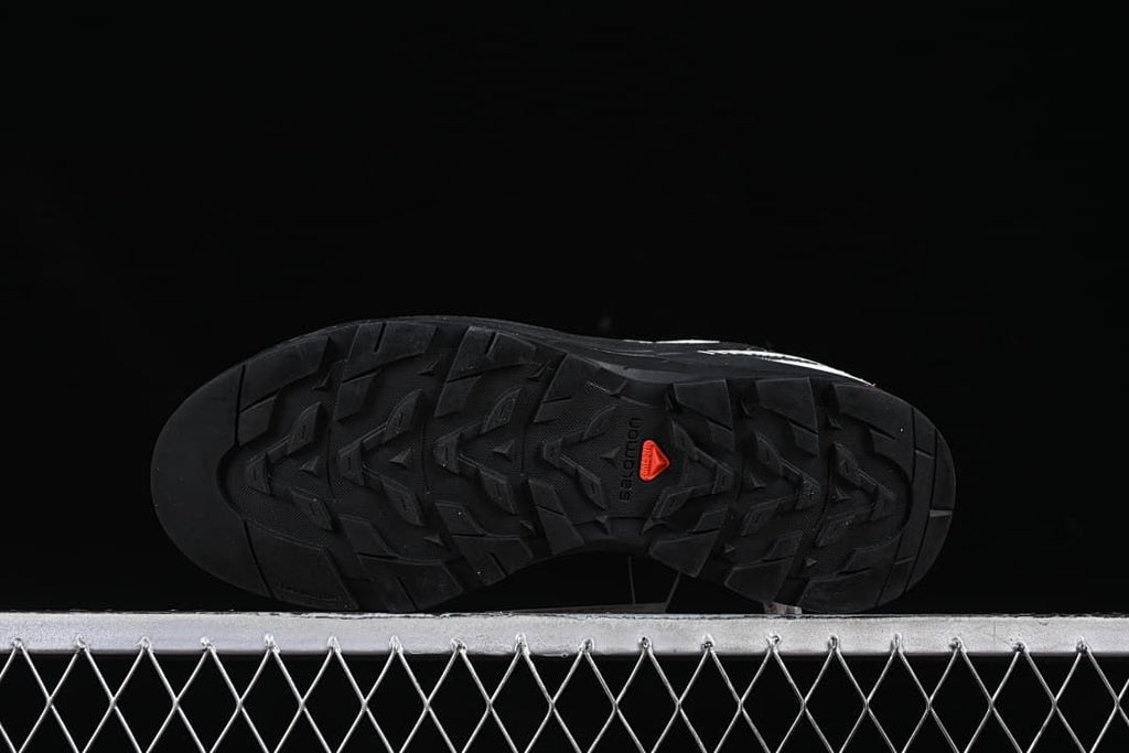 Underside of the shoe showing the patterned outsole.