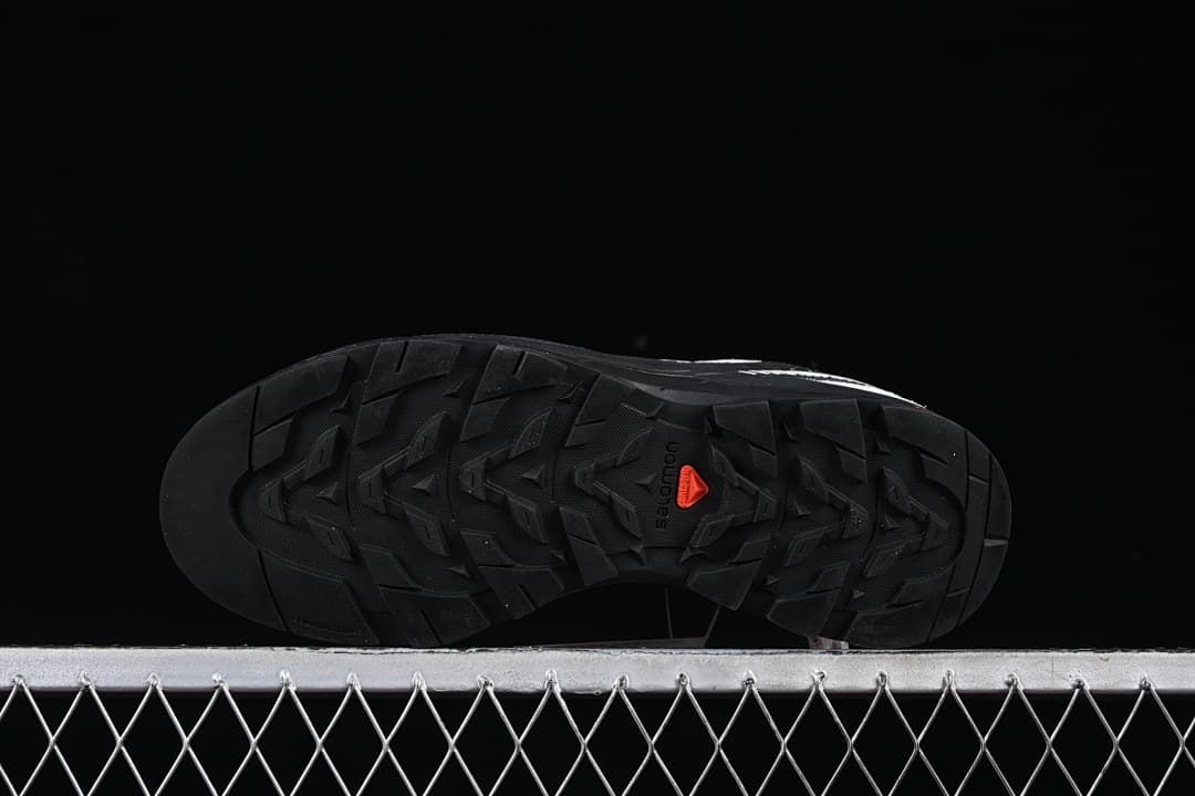 Underside of the shoe showing the patterned outsole.
