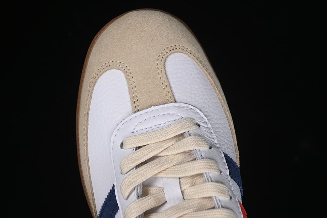 Top-down close-up of the sand-colored toe overlay and cream laces