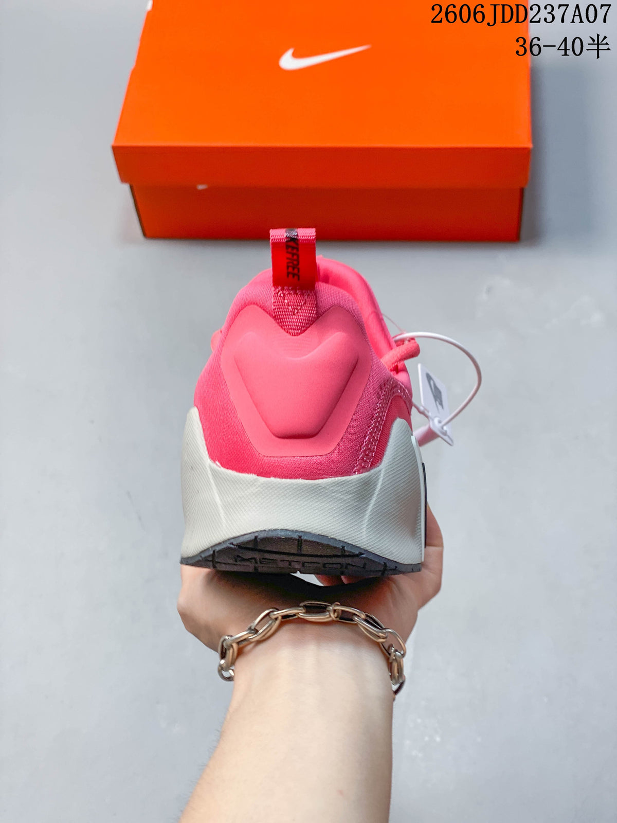 Rear view showing the pink heel and light-colored sole.
