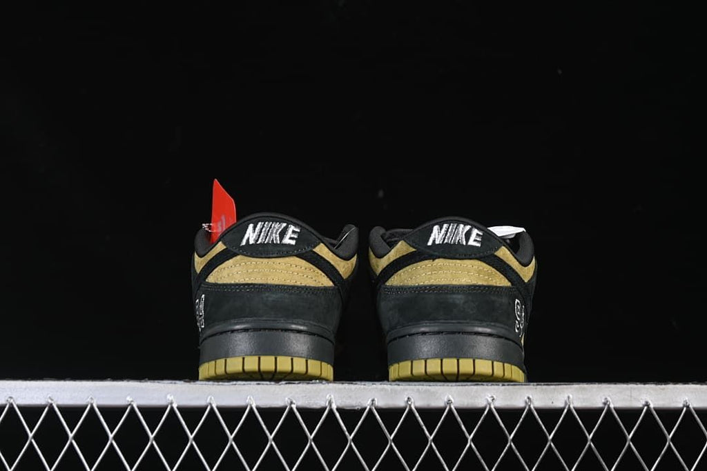 Rear view of both sneakers showing embroidered heel tabs