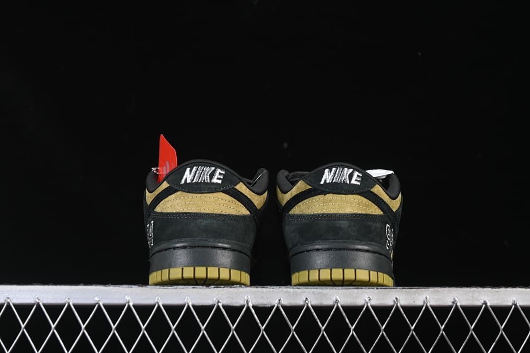 Rear view of both sneakers showing embroidered heel tabs