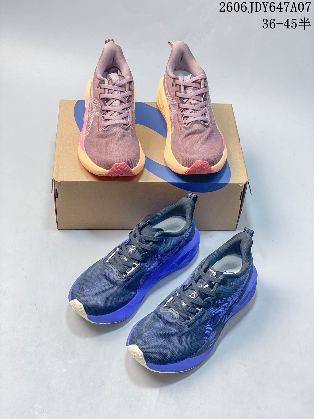 Mauve and navy ASICS Novablast 5 shoes shown from above and at an angle.