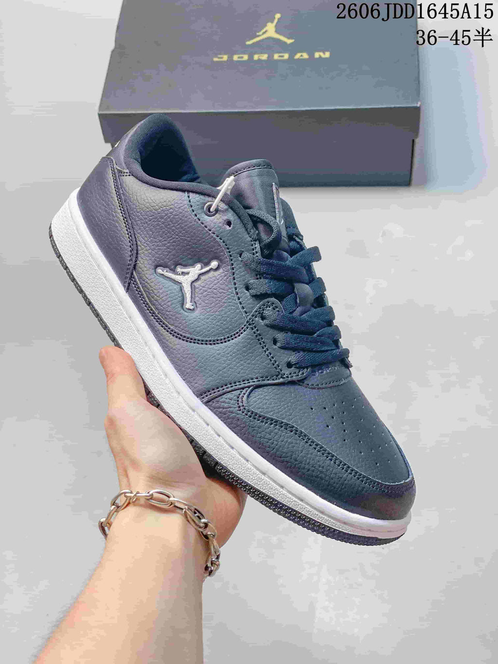 Side view of a tonal gray Jordan Court Connect sneaker with a white midsole.