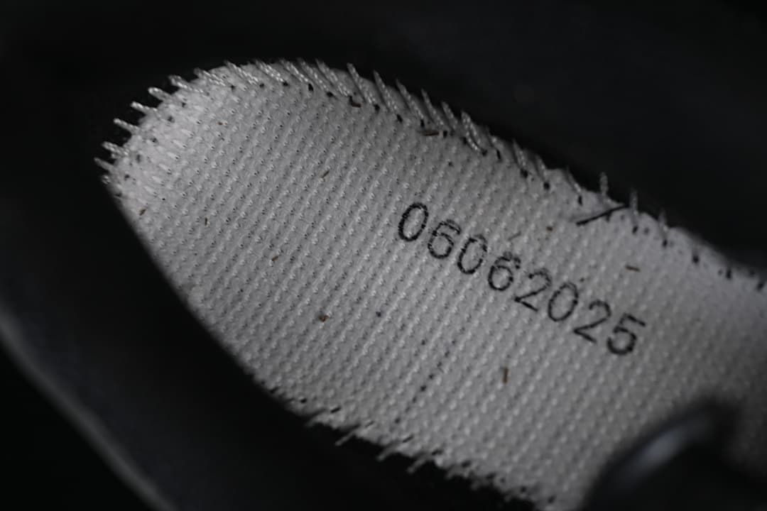 Close-up of an interior shoe label with printed production text