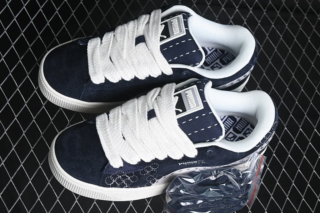 Pair of navy and white Puma Suede XL sneakers viewed from above