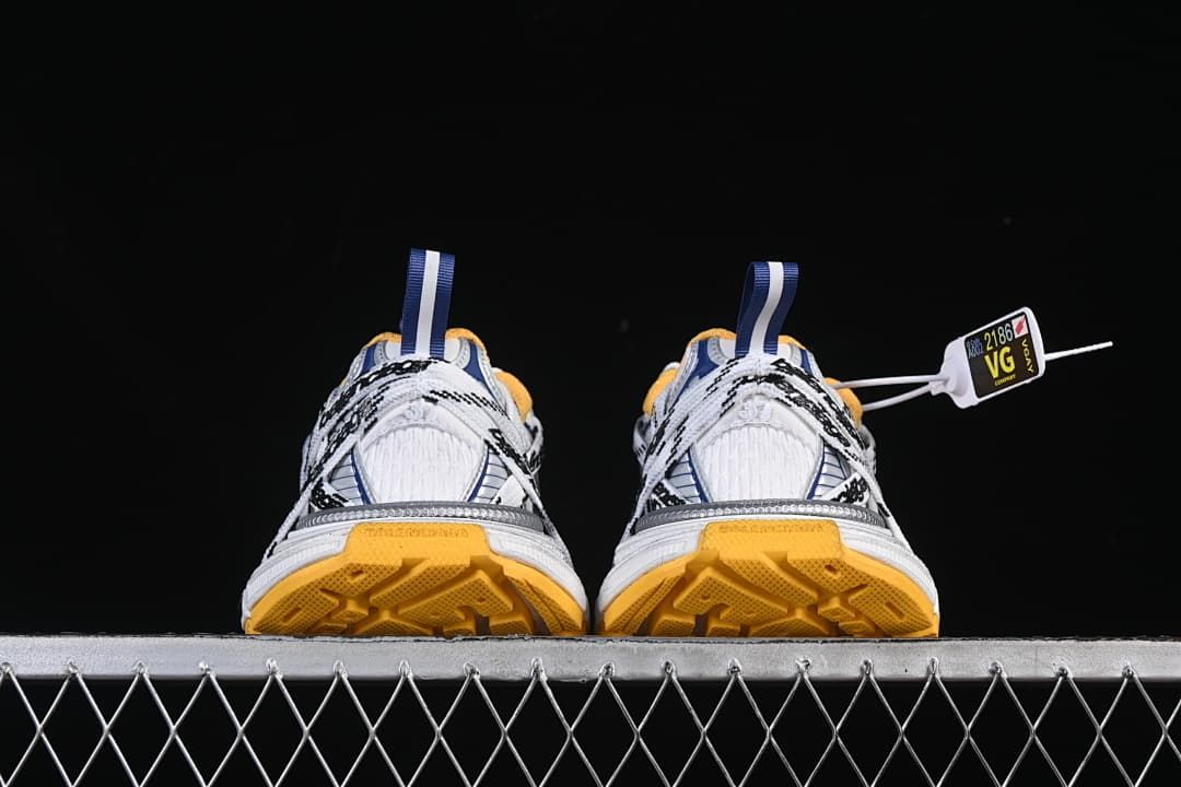 Rear view of both sneakers with orange outsole sections