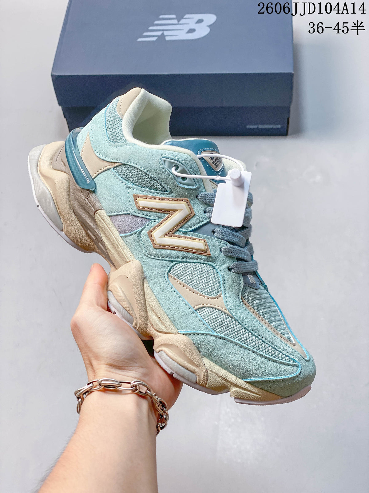 Light blue and cream New Balance 9060 sneaker with mesh panels and a sculpted sole.