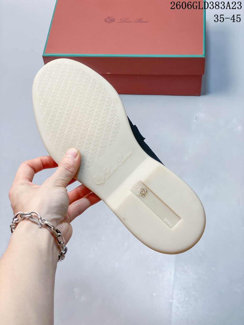 Underside of a loafer showing a patterned light-colored sole
