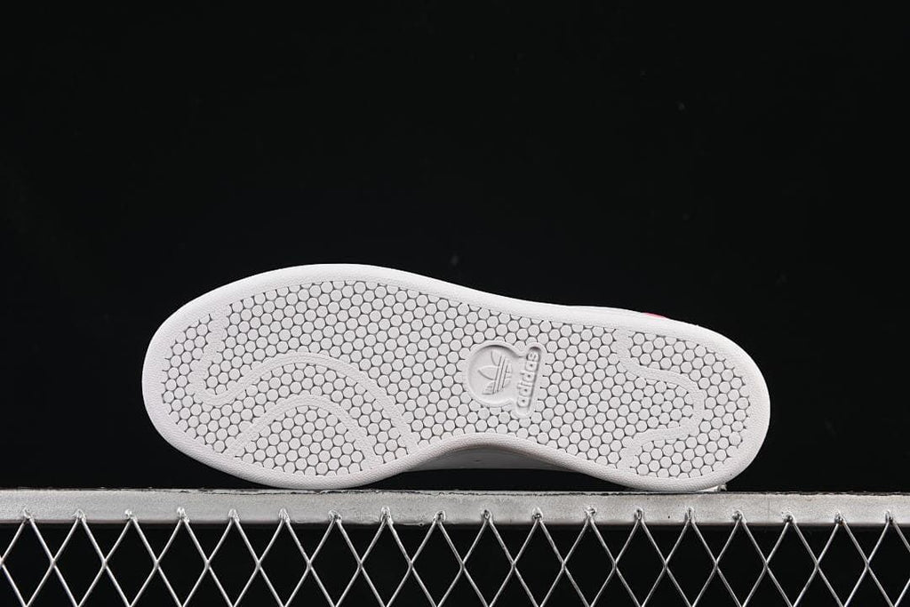 Underside of the sneaker showing the patterned outsole