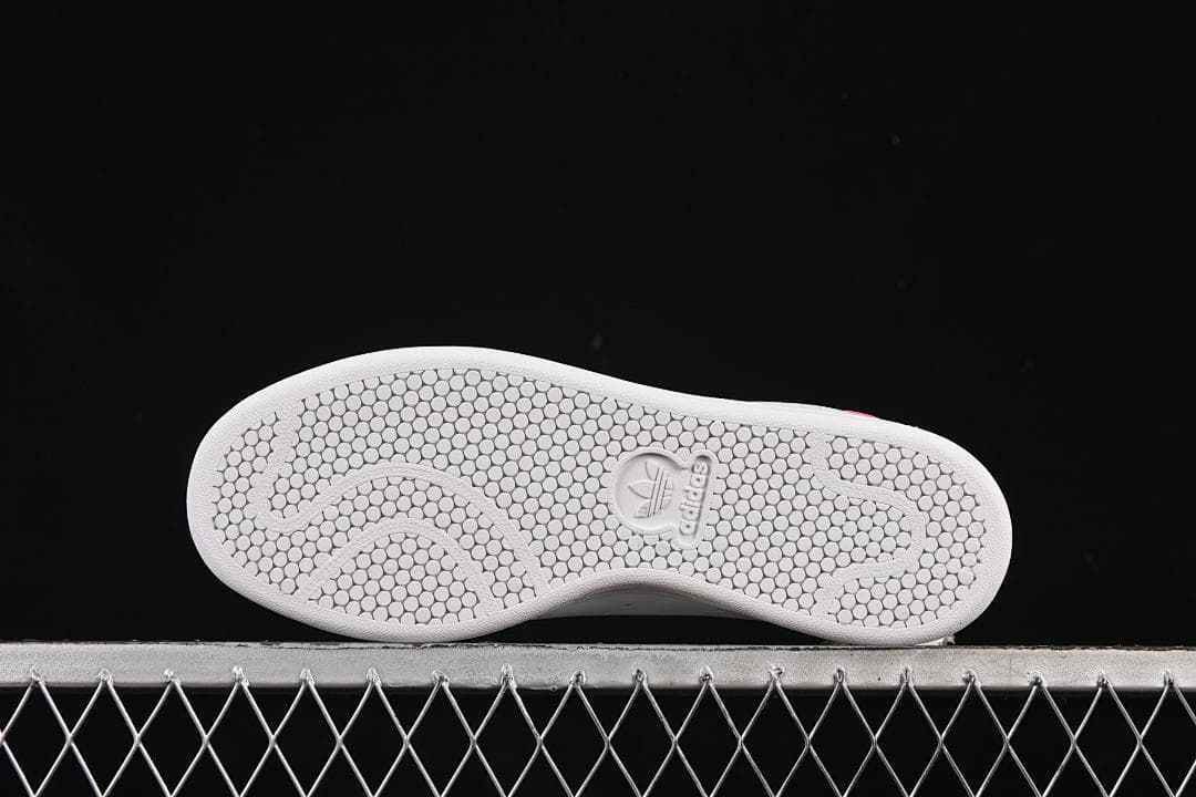 Underside of the sneaker showing the patterned outsole