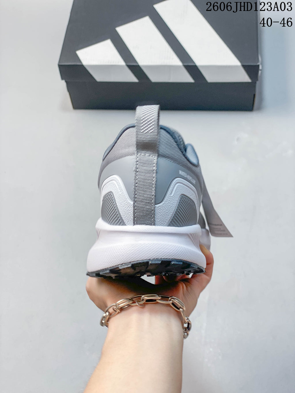 Rear view of a grey Adidas Runfalcon 5 TR shoe showing the heel and outsole