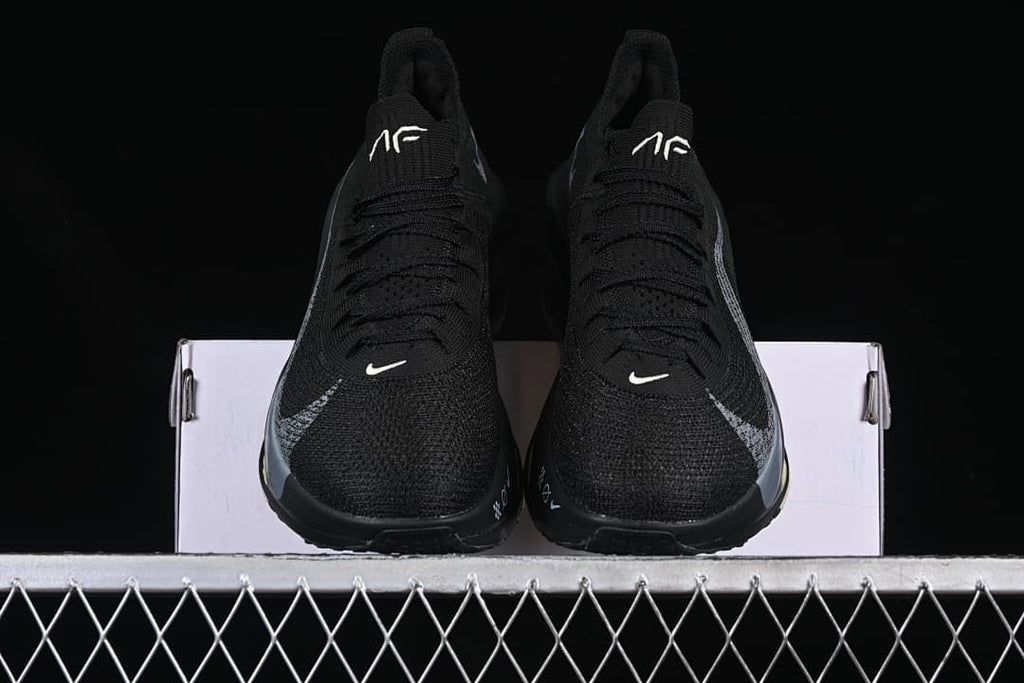 Front view of the pair showing laces, toe areas, and tongue logos
