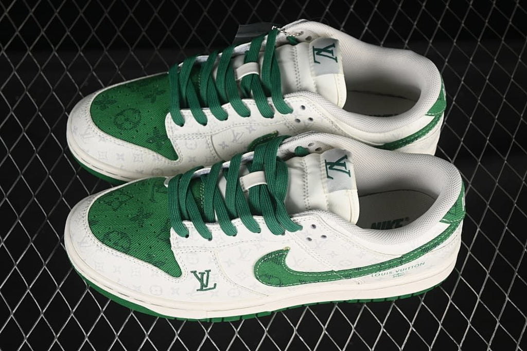 Pair of white and green low-top sneakers photographed from above, showing green laces and patterned panels