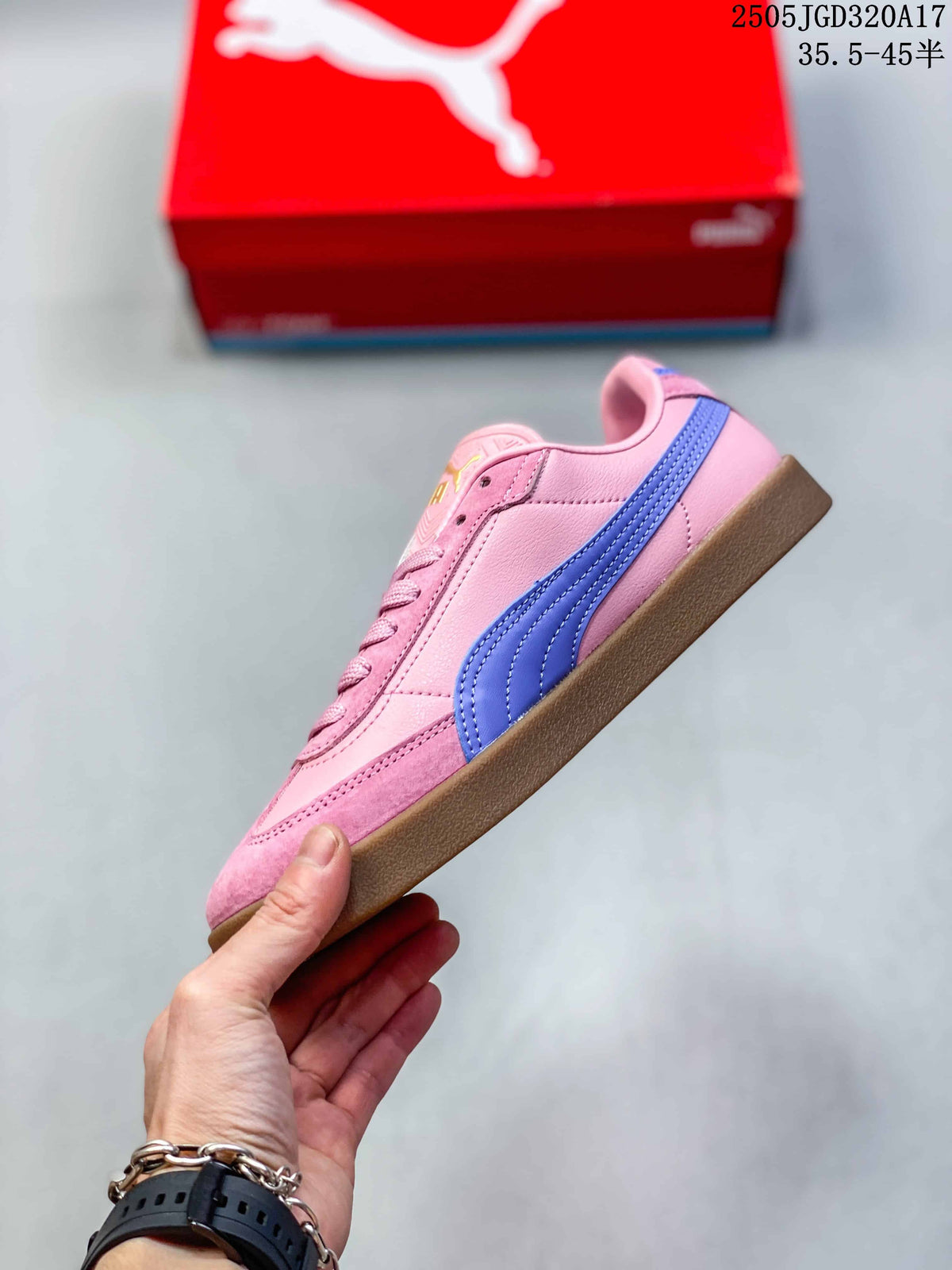 Side profile of a pink PUMA Club II Era sneaker with a blue stripe and gum-colored sole
