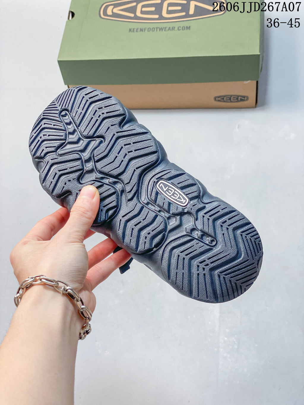 Close-up of the sandal outsole showing its sculpted tread pattern.