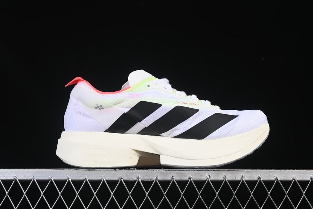 Side profile of the white running shoe with three black stripes and a sculpted midsole.