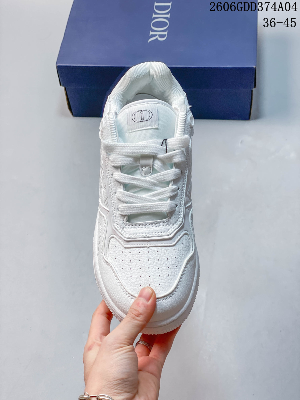 Top view of a white lace-up sneaker with perforated toe panel