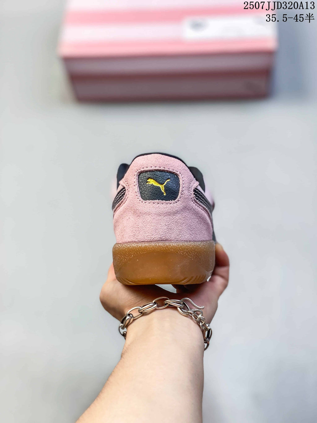 Rear view of a pink Puma Palermo sneaker with a gum-colored heel and logo patch