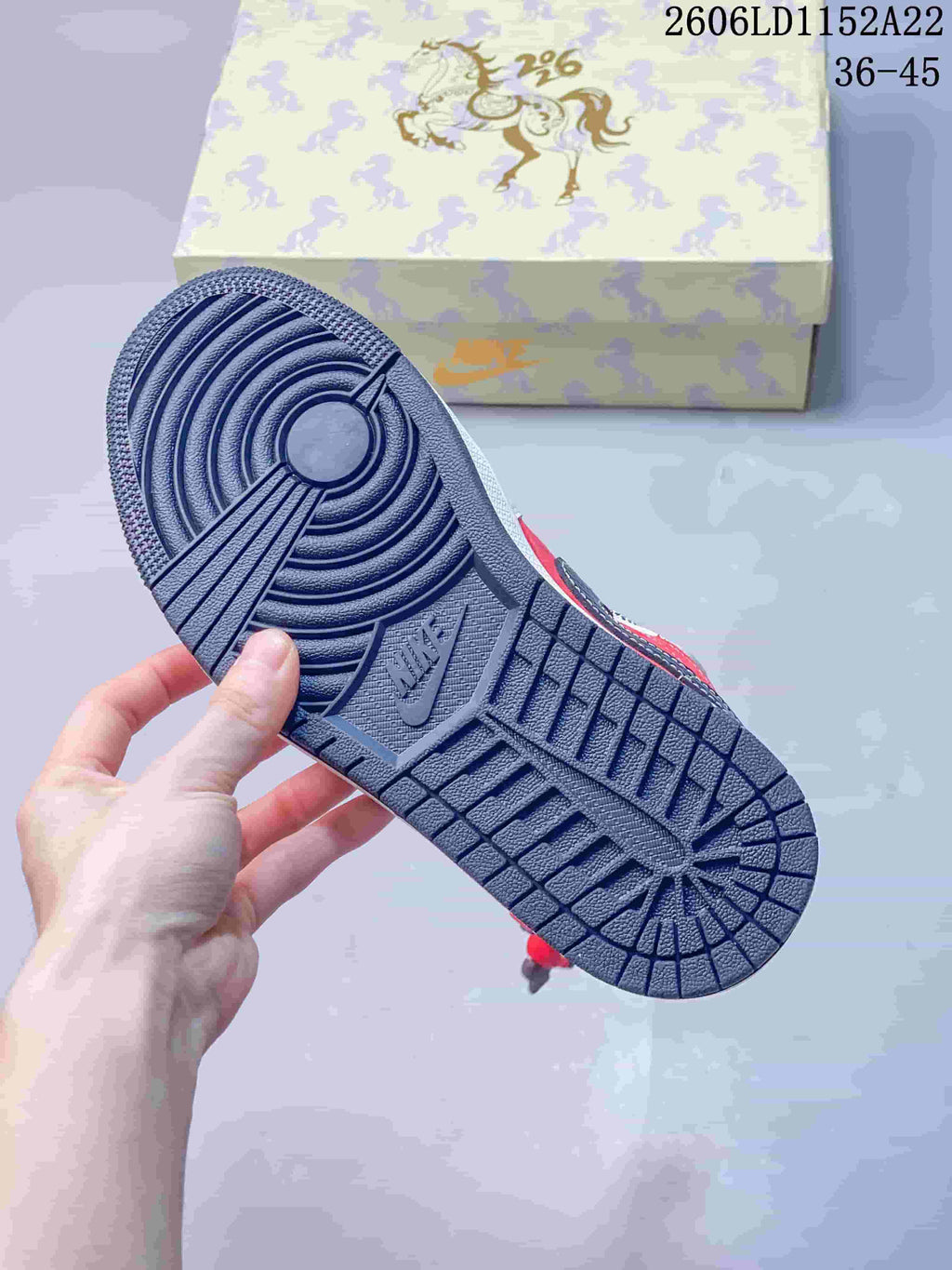 Close-up of the dark navy patterned outsole on a Jordan sneaker