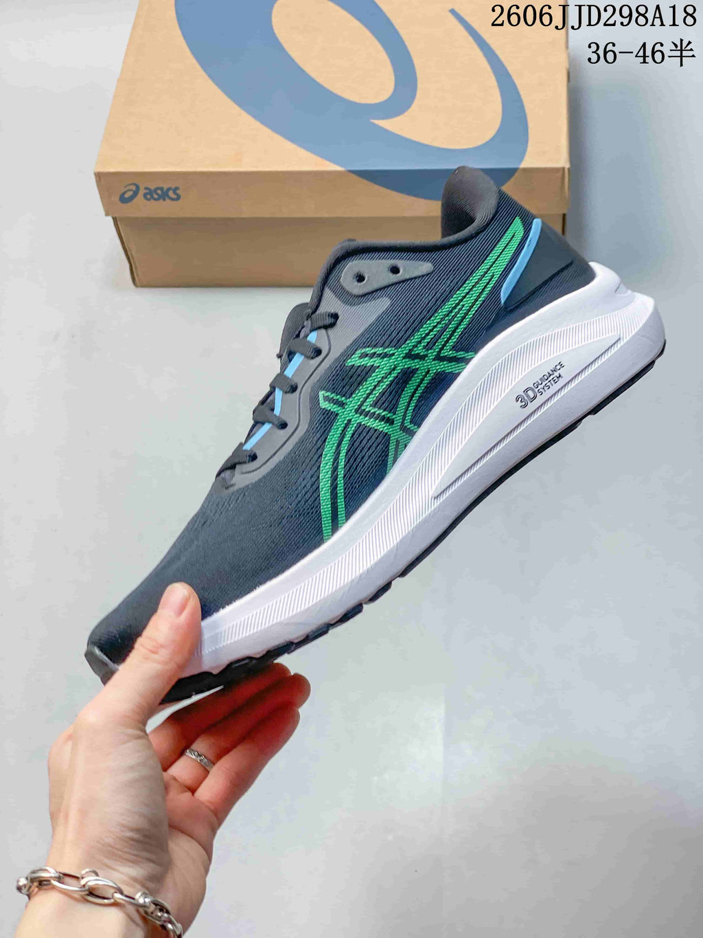 Side view of a navy ASICS GT-1000 13 running shoe with green accents and a white midsole.